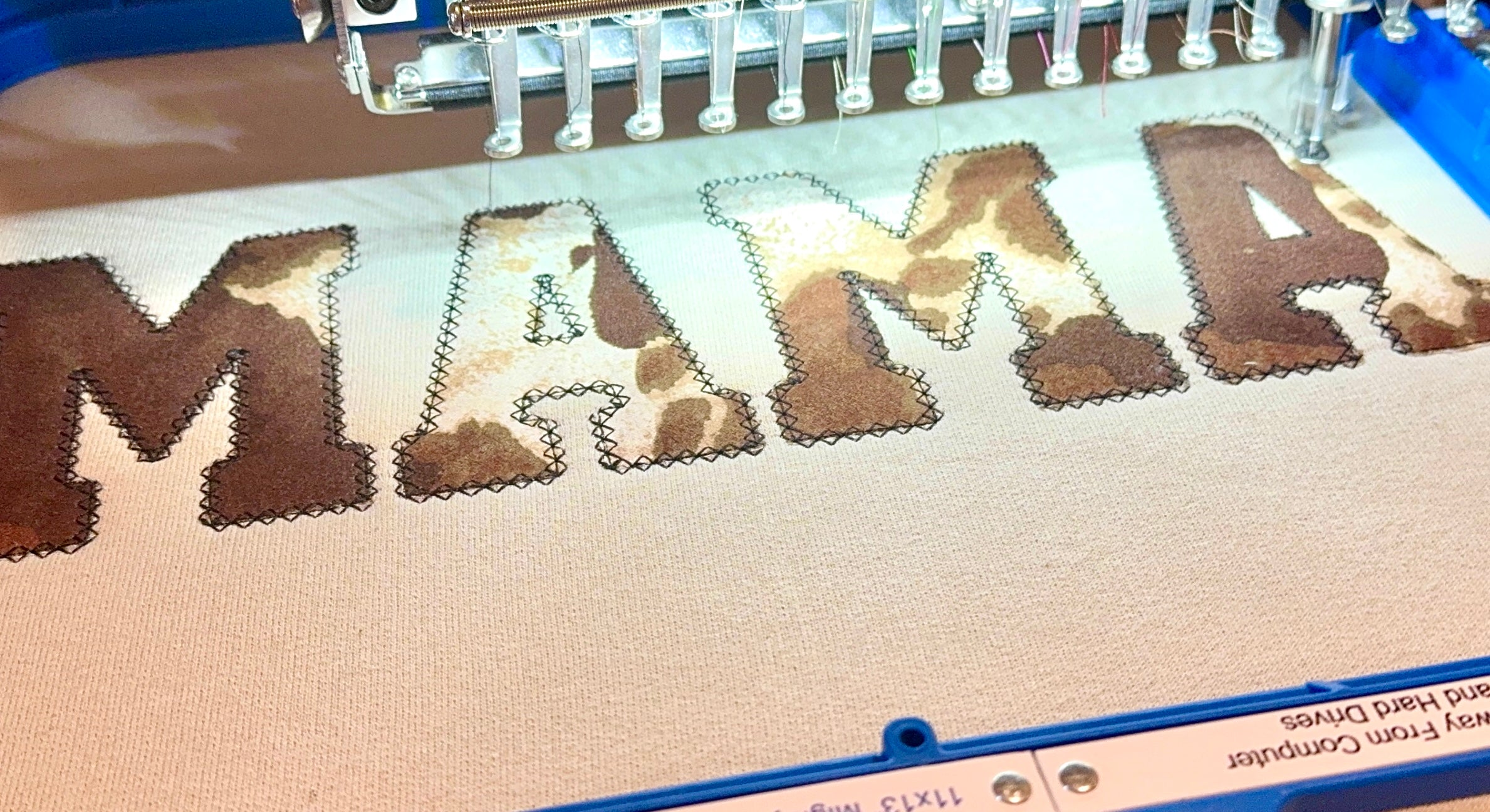 This MAMA Loves Her Herd | Cow Print Applique Crewneck